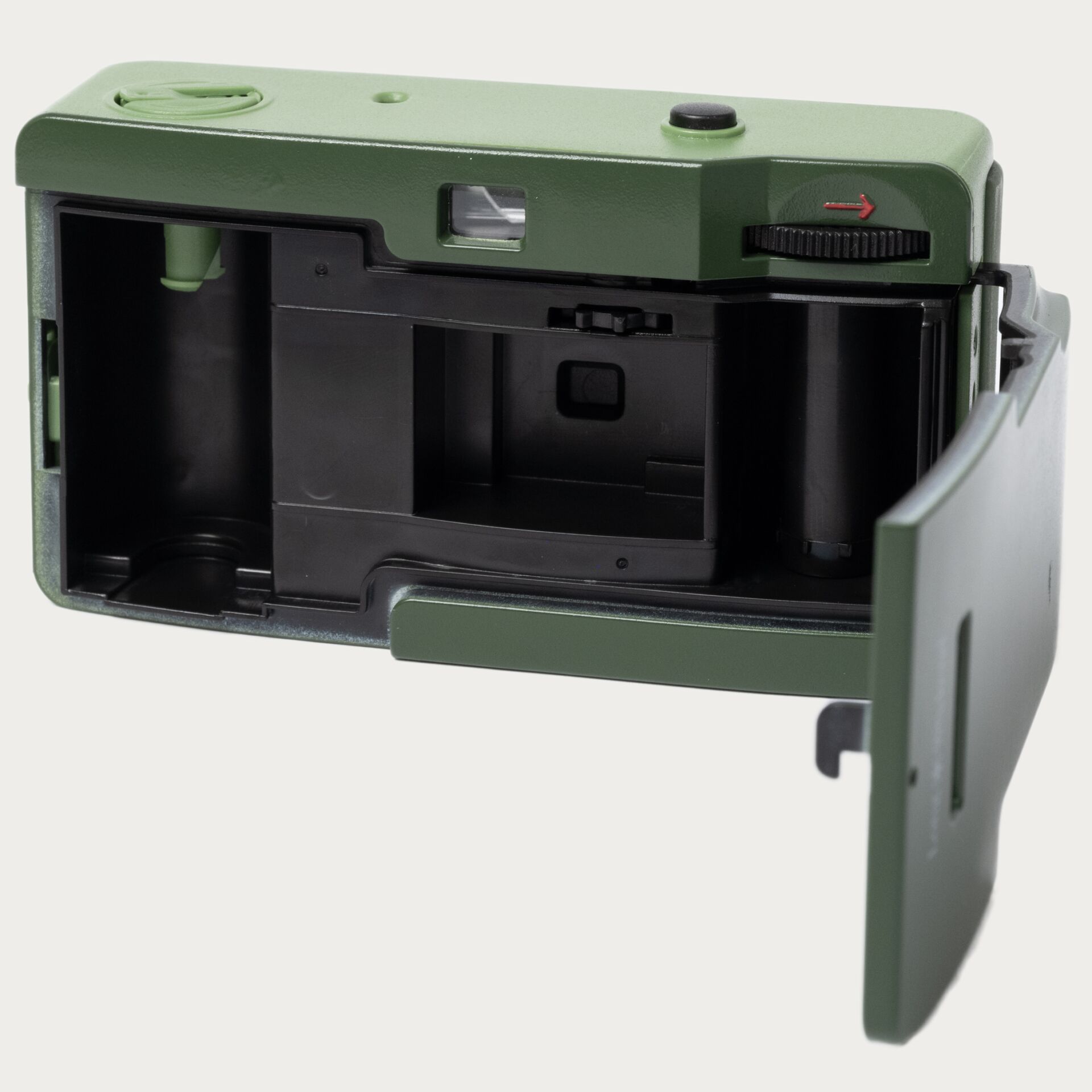 Polaroid-Ansicht, Kamera-Rückseite, leere Batteriefach, grüner Kamerakorpus, ausklappbares Fach