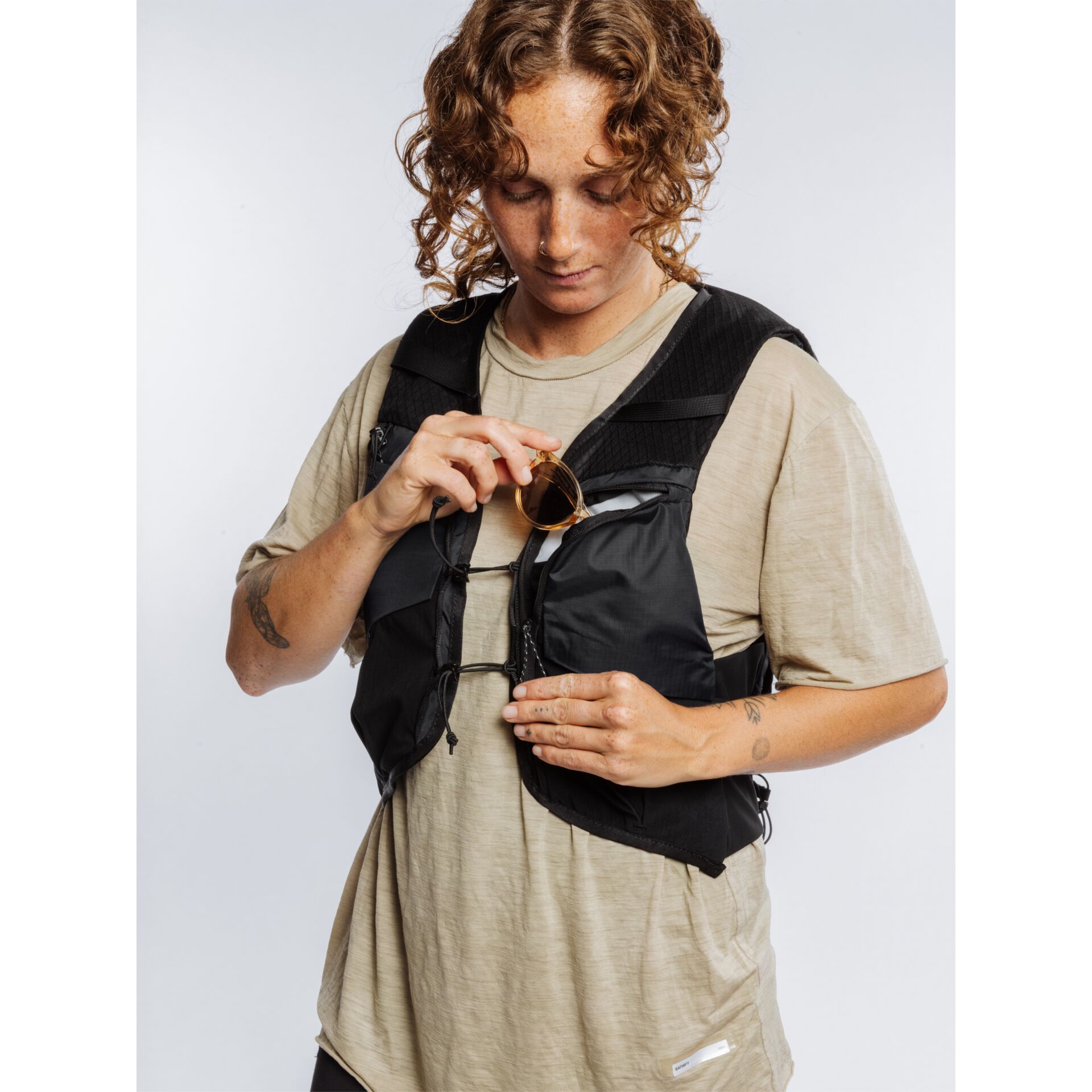 tech vest, padded vest, black vest, adjustable straps, multipocket vest