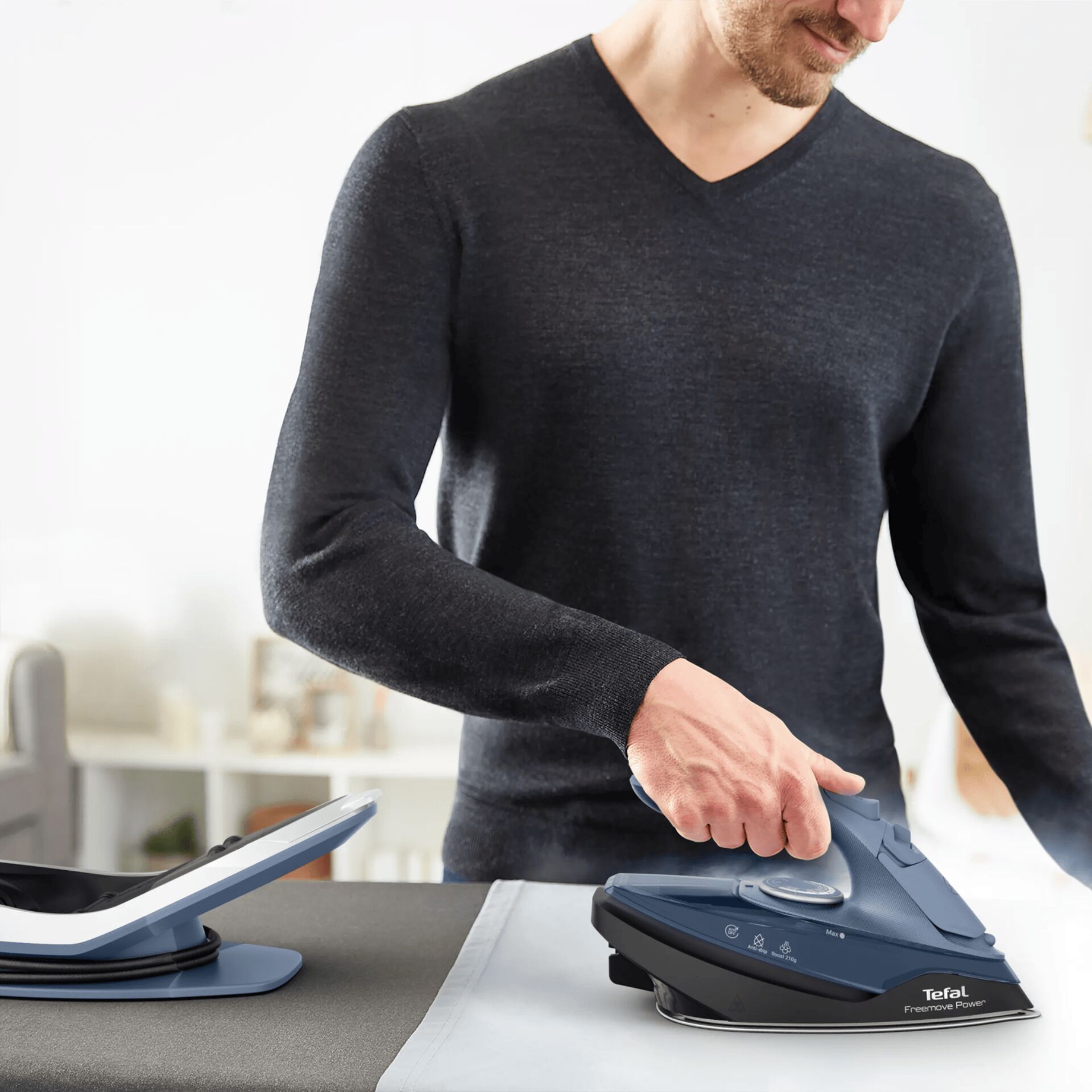glossy blue iron, steam iron, home appliance, iron with soleplate, cordless? no cord visible