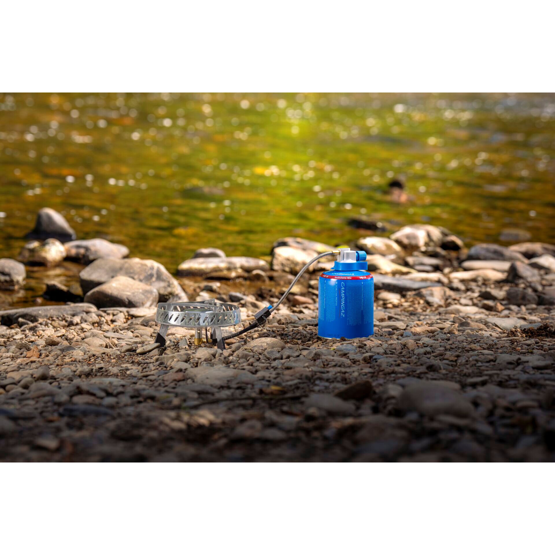 camp stove, Gas canister, Outdoor cooking, Camping gear, Rocky shore