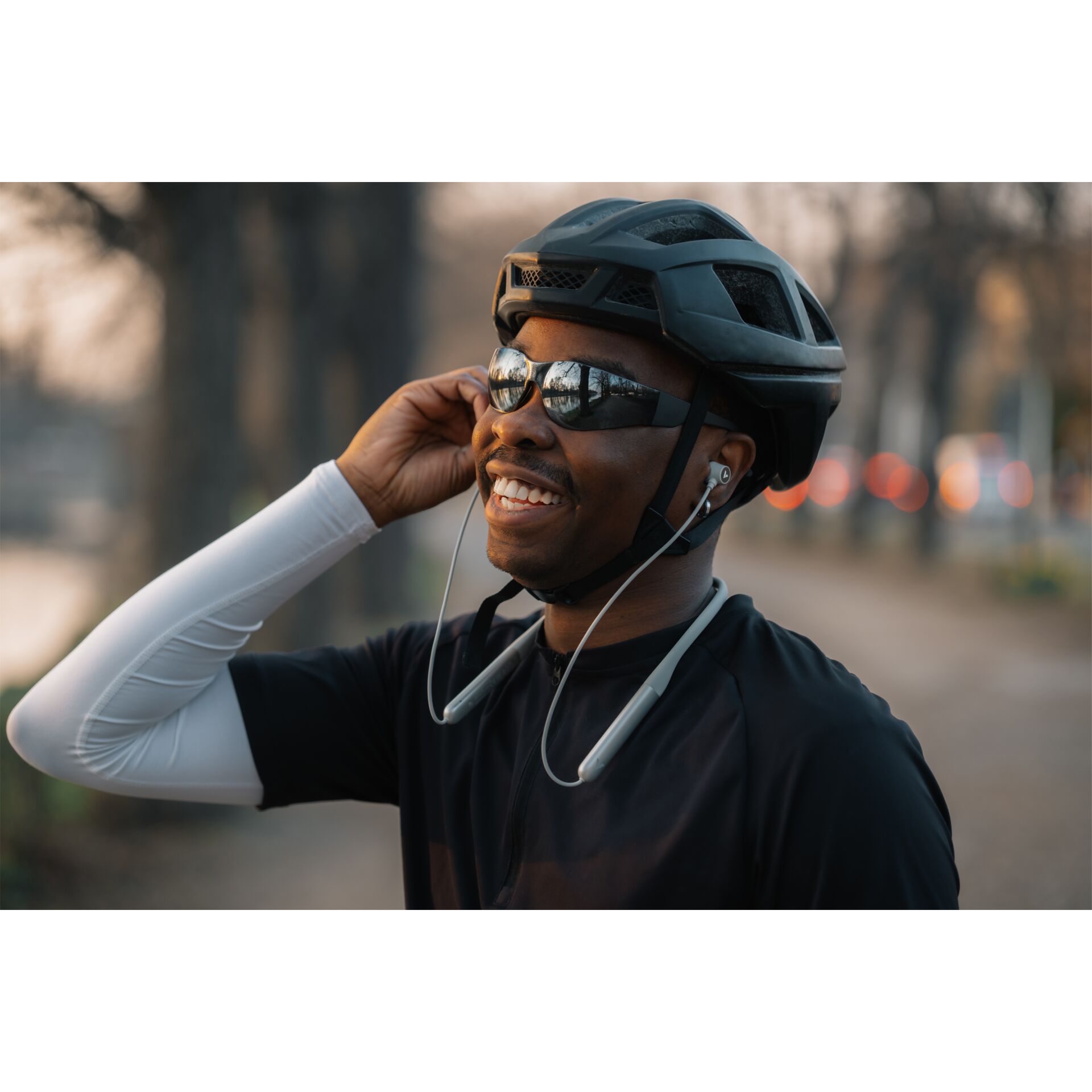  cycling, helmet, sunglasses, earbuds, athletic