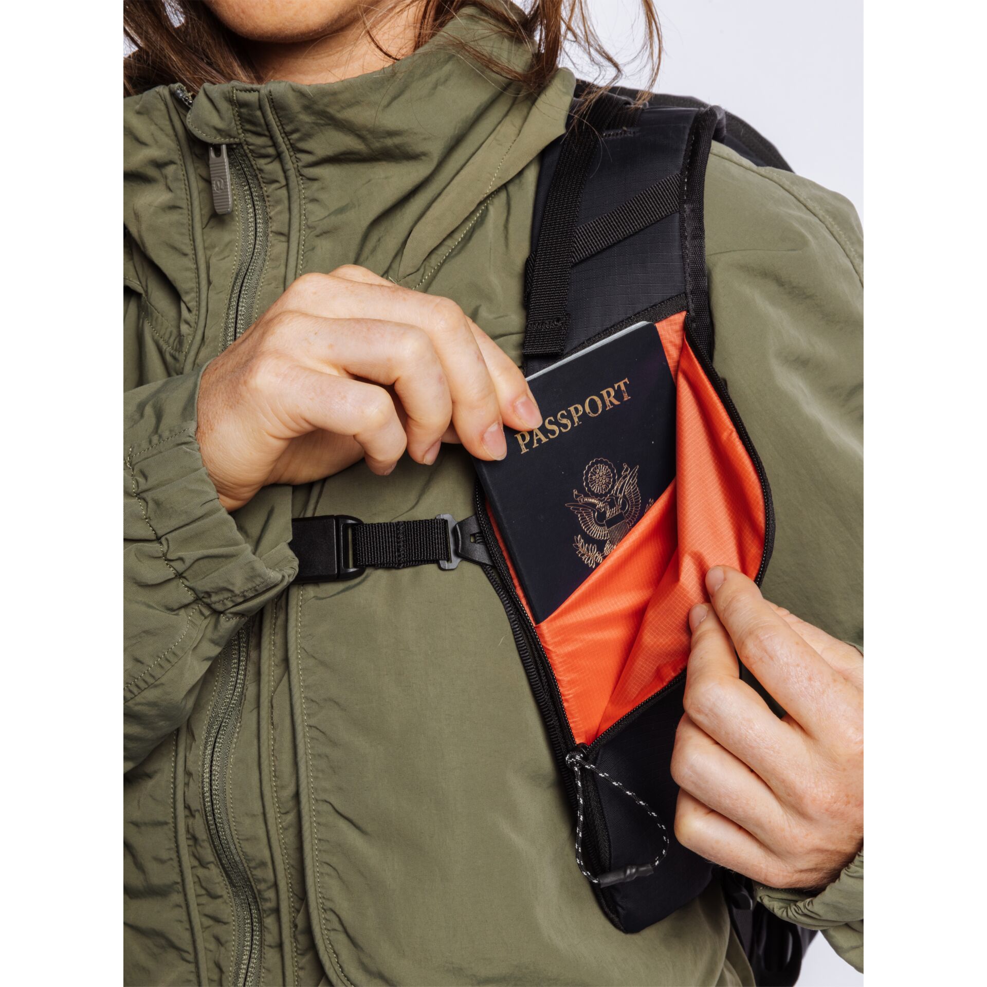 passport, wallet, zippered pocket, orange lining, backpack strap