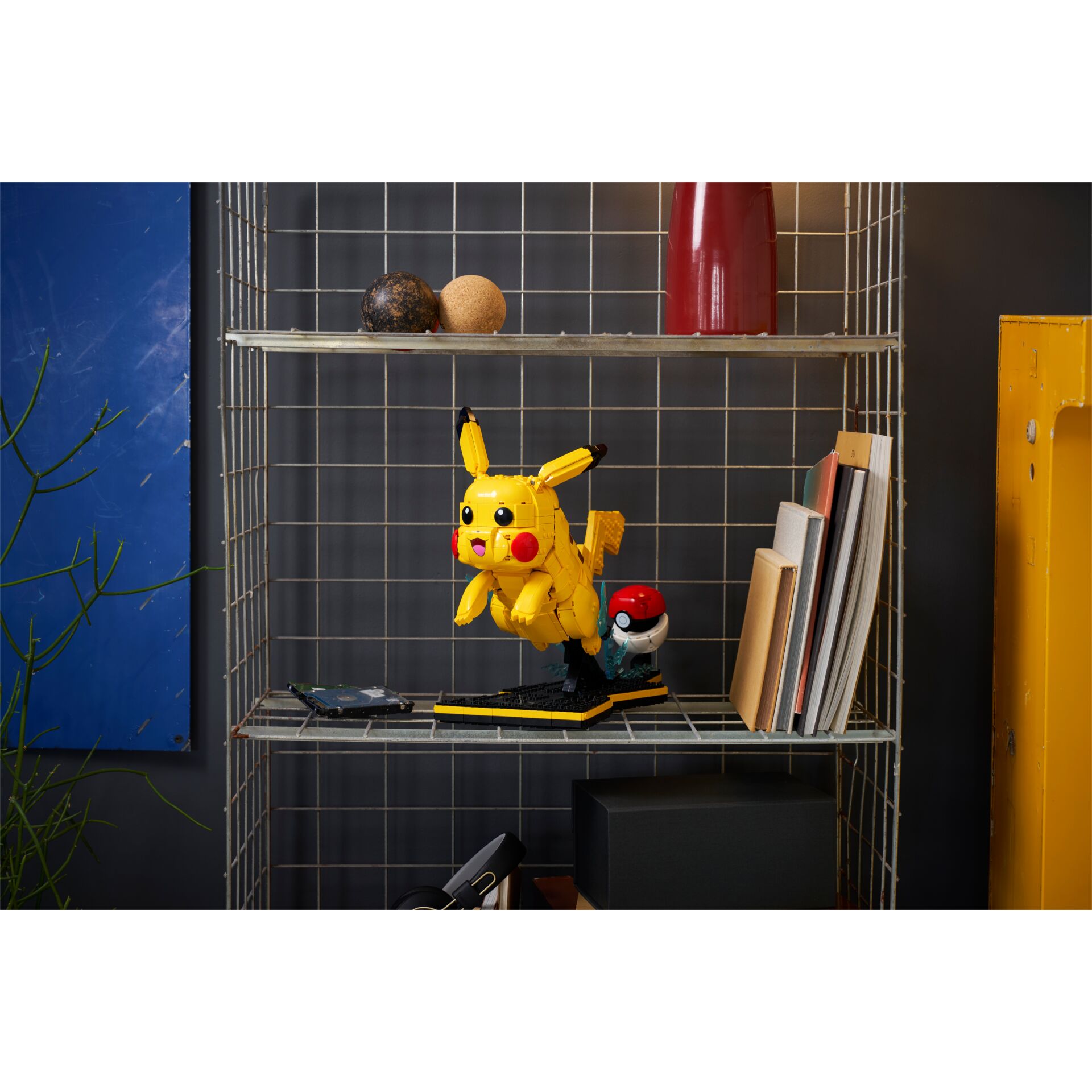 pokemon figurine, pikachu style, yellow toy, lego figure, shelf decor