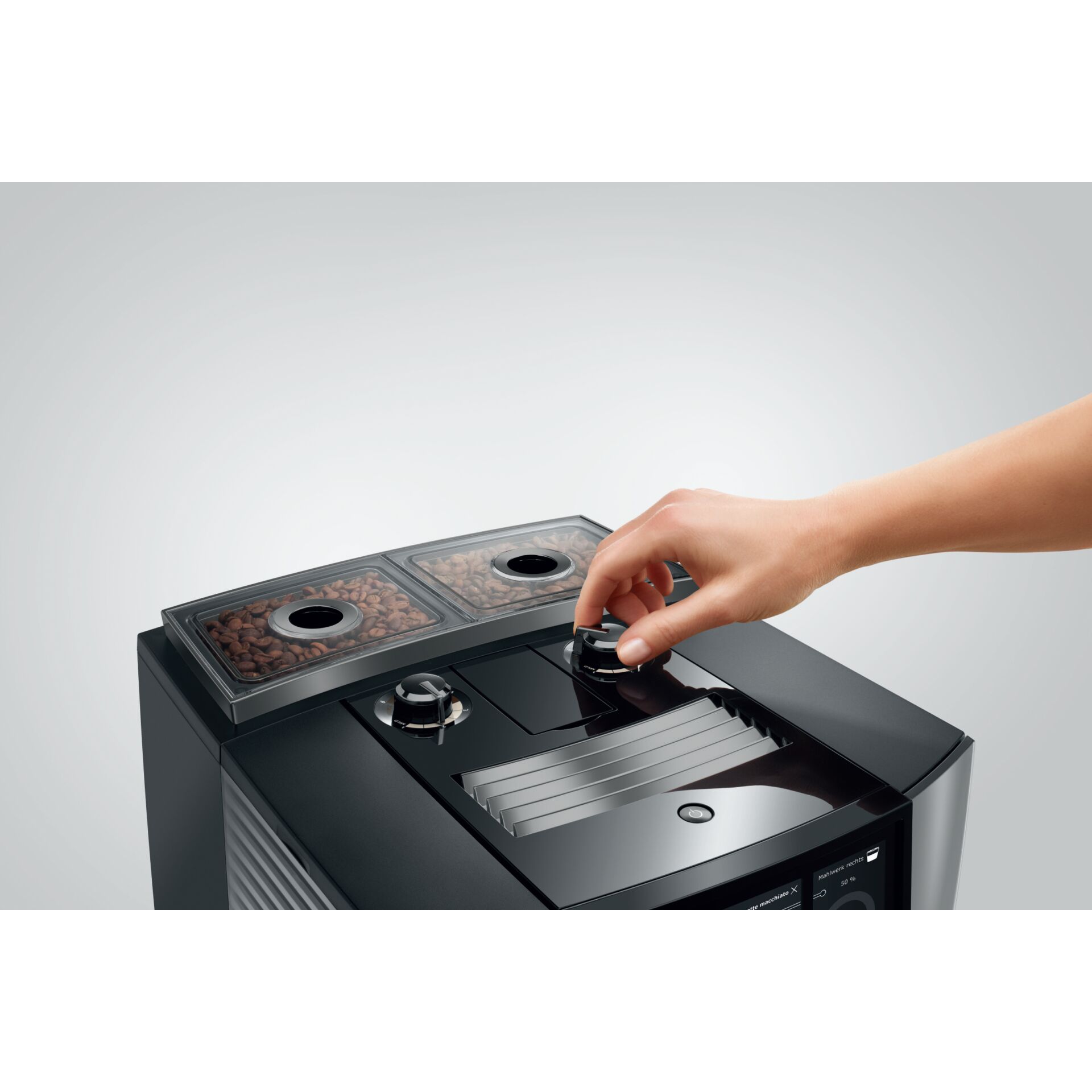 Kaffeemaschine, Kaffeebehälter, Mahlwerk, Bedienknopf, Kaffeezubereitung